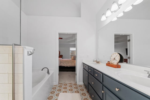 bathroom with a bath, a sink, ensuite bath, and double vanity