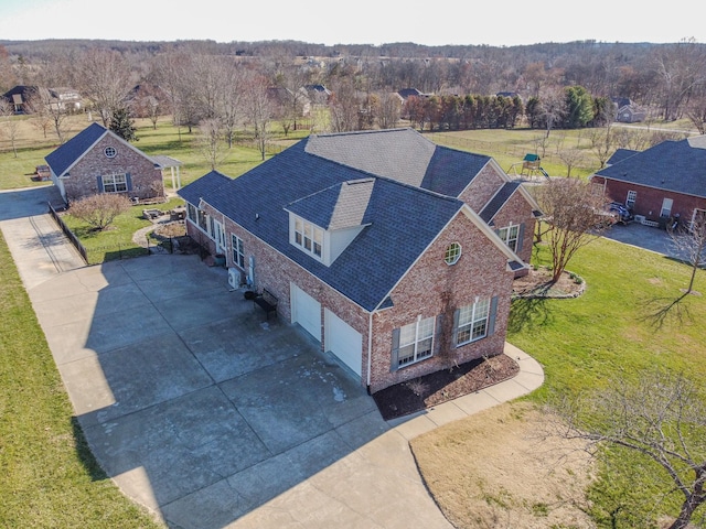 birds eye view of property with a view of trees