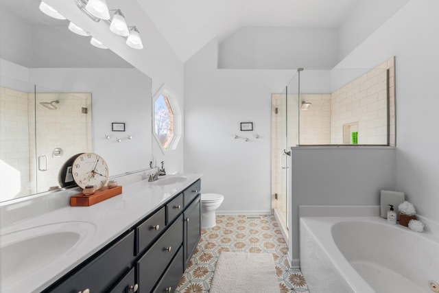 bathroom featuring lofted ceiling, toilet, a bath, a shower stall, and a sink