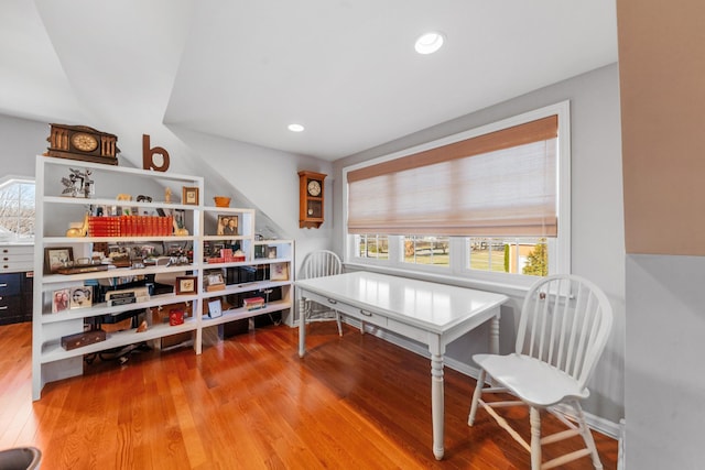 interior space with recessed lighting, a wealth of natural light, and wood finished floors