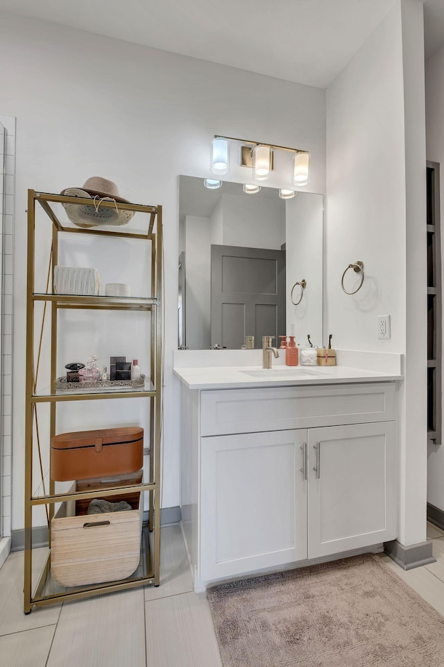 bathroom with vanity and baseboards