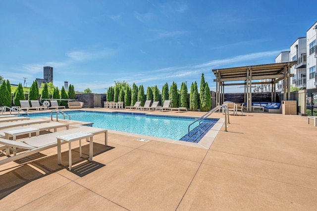 community pool with fence and a patio