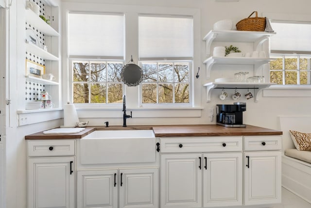 bar featuring plenty of natural light and a sink