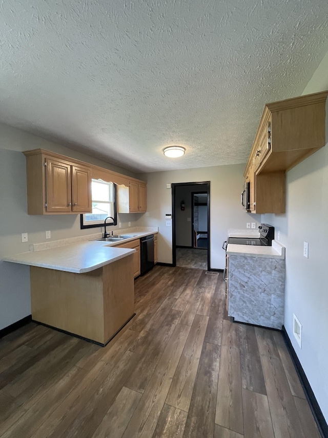 107 Sandy Rd, Unionville, TN 37180 - kitchen featuring a textured ceiling, a peninsula, visible vents, a sink, and light countertops