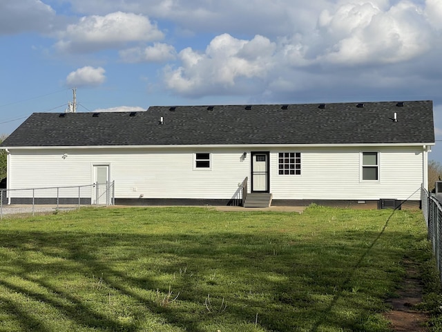 107 Sandy Rd, Unionville, TN 37180 - back of property featuring entry steps, fence, a shingled roof, and a yard