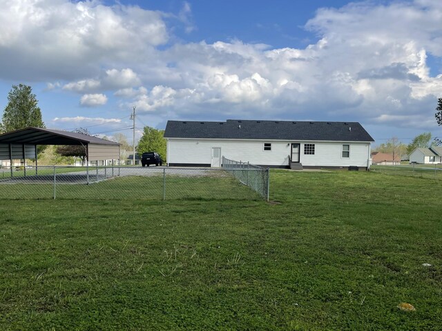 107 Sandy Rd, Unionville, TN 37180 - back of property featuring a carport, entry steps, a lawn, fence, and driveway