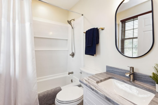 bathroom with shower / bath combination with curtain, vanity, and toilet