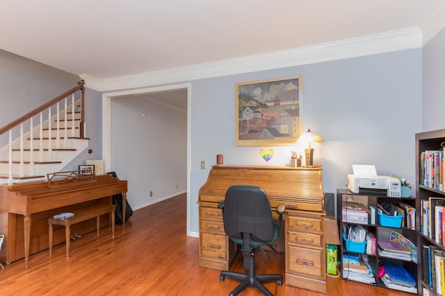 home office featuring baseboards, ornamental molding, and wood finished floors