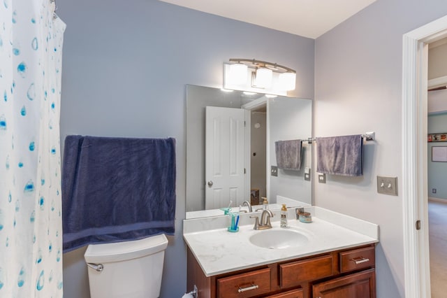 full bathroom with vanity and toilet