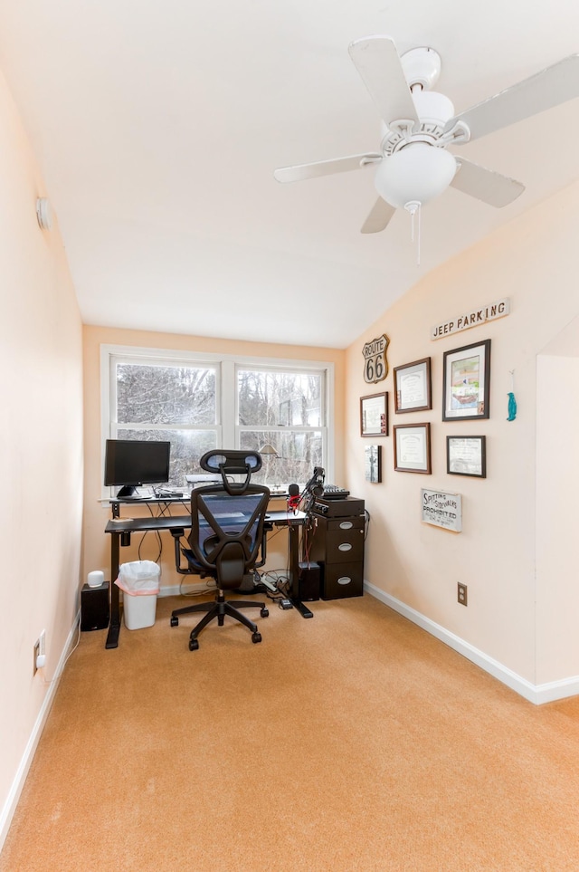 carpeted home office with a ceiling fan and baseboards