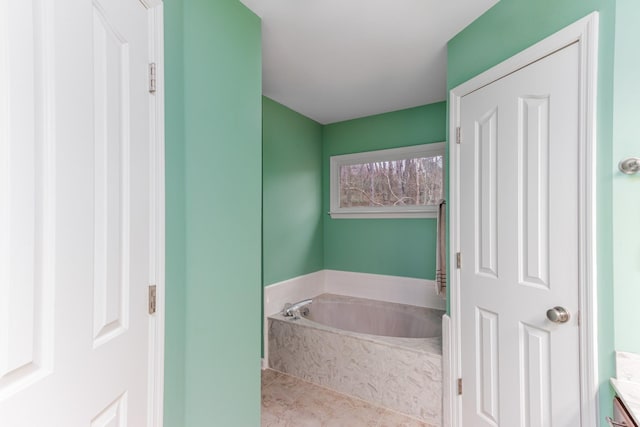 full bathroom with a bath and tile patterned floors