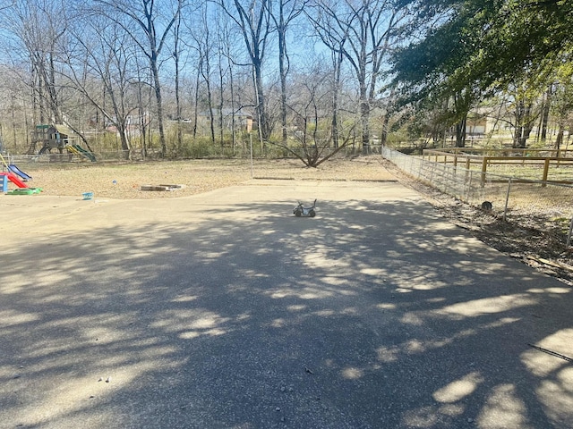 view of yard with fence and playground community