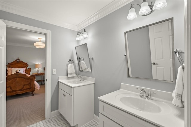 ensuite bathroom featuring ornamental molding, ensuite bath, two vanities, and a sink