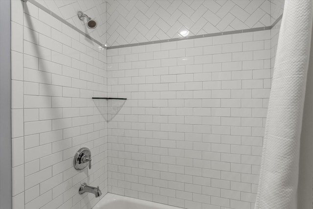 bathroom with shower / bath combination with curtain