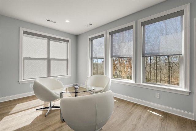 sitting room featuring recessed lighting, visible vents, baseboards, and wood finished floors