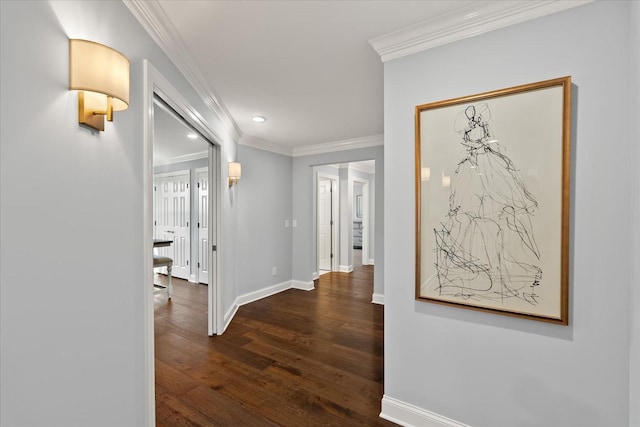 hallway with ornamental molding, recessed lighting, baseboards, and wood finished floors