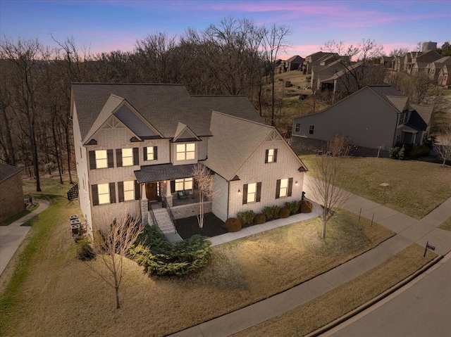 view of front of property featuring brick siding