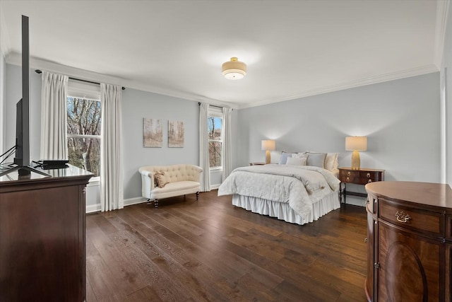 bedroom with ornamental molding, dark wood finished floors, and baseboards