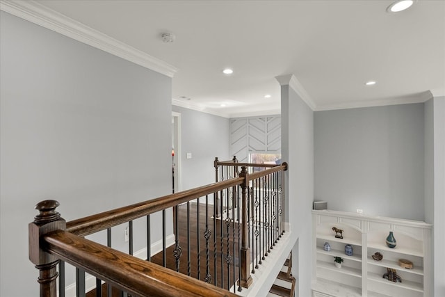 hallway featuring ornamental molding, recessed lighting, baseboards, and an upstairs landing