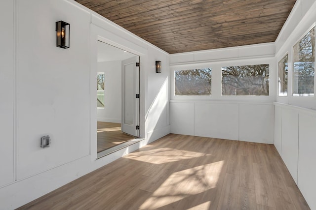 unfurnished sunroom featuring wooden ceiling