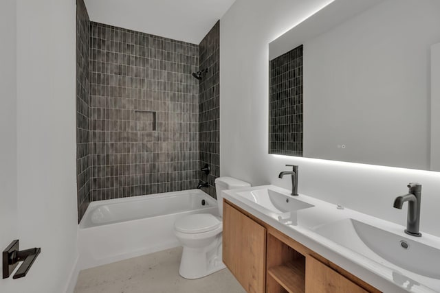 full bathroom featuring double vanity, shower / bath combination, a sink, and toilet