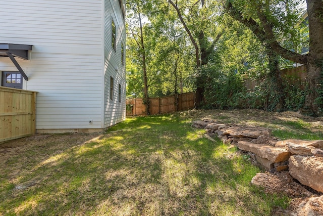 view of yard with a fenced backyard