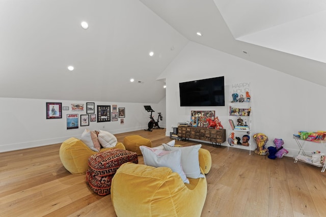 living room with light wood-type flooring, recessed lighting, baseboards, and lofted ceiling