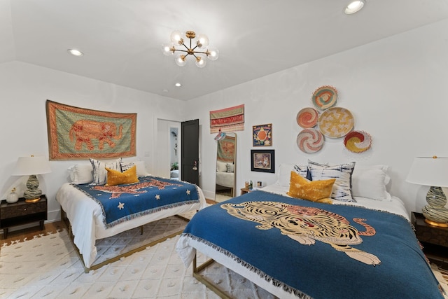 bedroom with a chandelier, recessed lighting, and baseboards