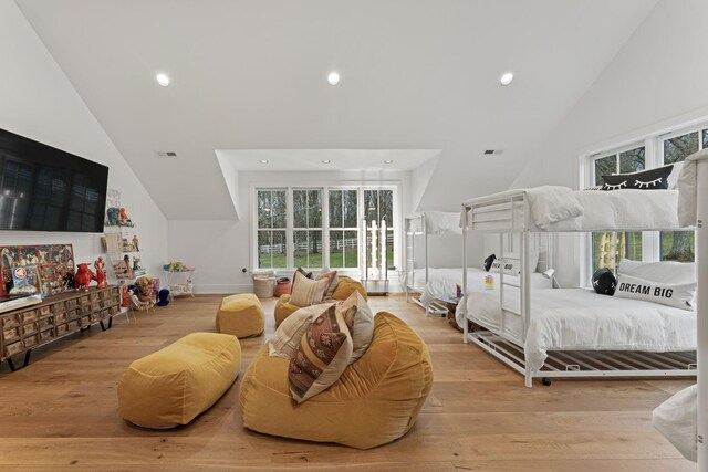 bedroom with high vaulted ceiling, light wood-type flooring, visible vents, and recessed lighting