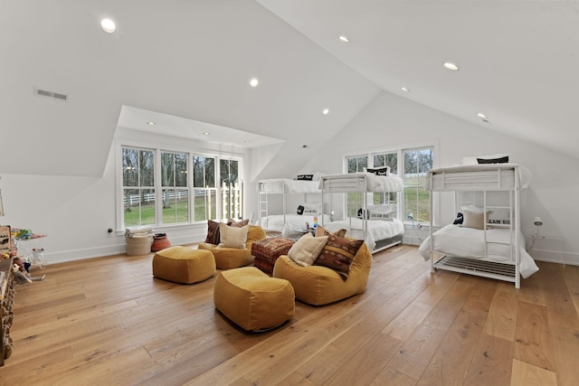 bedroom featuring light wood-type flooring, baseboards, and visible vents