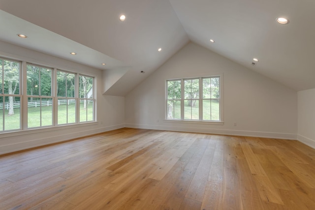 bonus room featuring lofted ceiling, baseboards, light wood finished floors, and recessed lighting