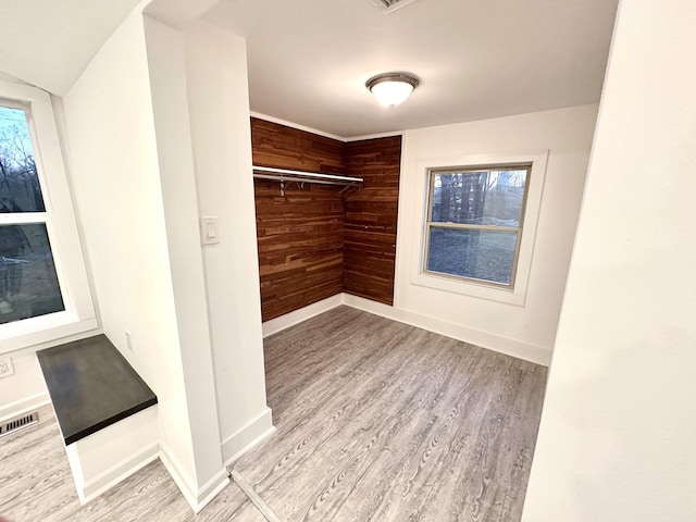 spacious closet featuring visible vents and wood finished floors