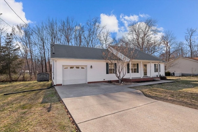 ranch-style house with covered porch, an attached garage, a shed, driveway, and a front lawn