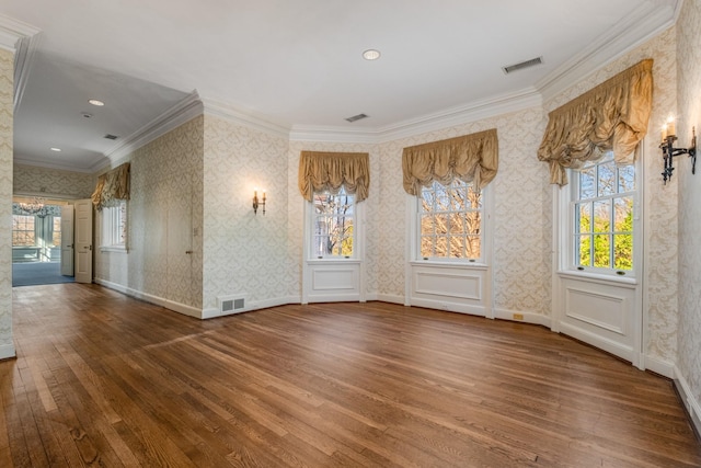 empty room with visible vents and wallpapered walls