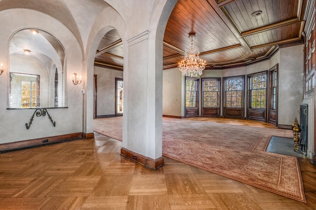 interior space featuring baseboards, arched walkways, wood ceiling, a fireplace with flush hearth, and a notable chandelier