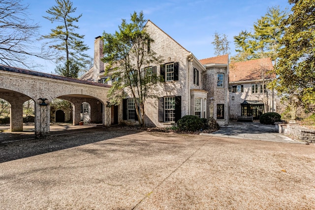 view of front of home featuring brick siding