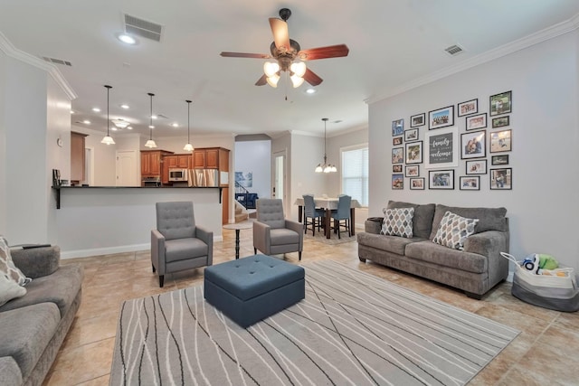 living area with recessed lighting, visible vents, crown molding, and baseboards