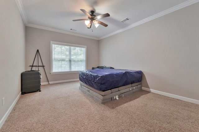 bedroom with baseboards, carpet, visible vents, and crown molding