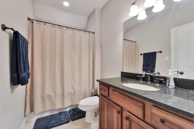 bathroom featuring shower / tub combo with curtain, vanity, toilet, and tile patterned floors