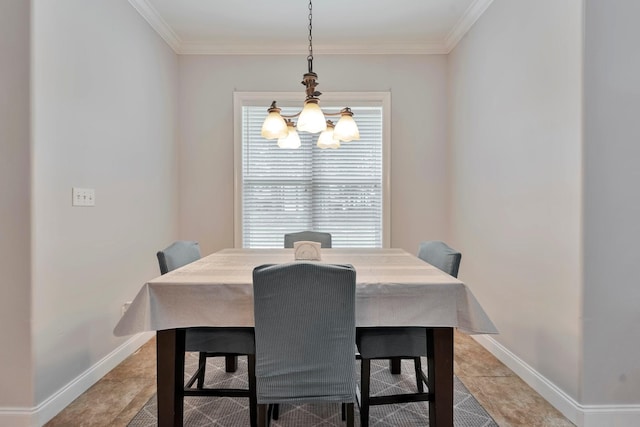 dining room featuring baseboards, ornamental molding, and a notable chandelier