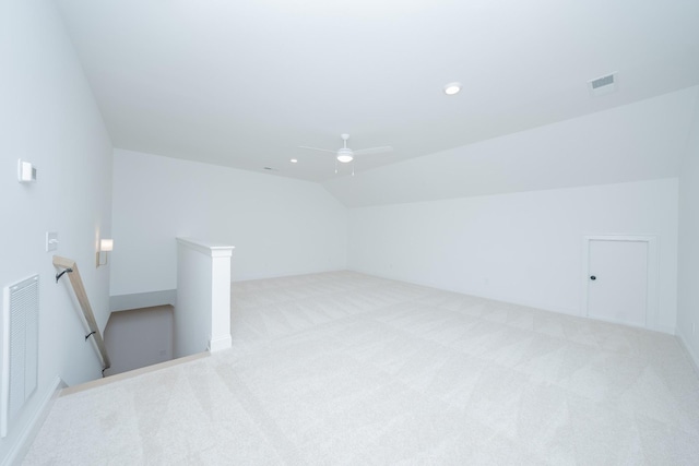 bonus room featuring lofted ceiling, recessed lighting, visible vents, and light colored carpet