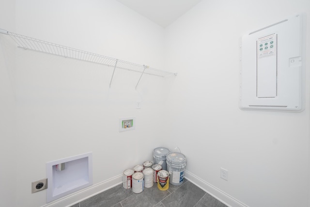 laundry room with laundry area, hookup for a washing machine, electric dryer hookup, and baseboards