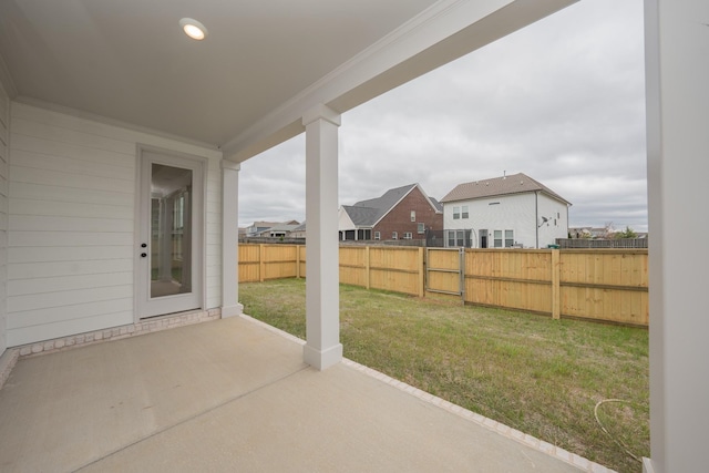 view of patio / terrace featuring a residential view and fence