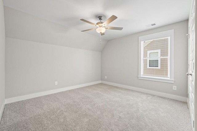 bonus room with ceiling fan, carpet flooring, visible vents, baseboards, and vaulted ceiling