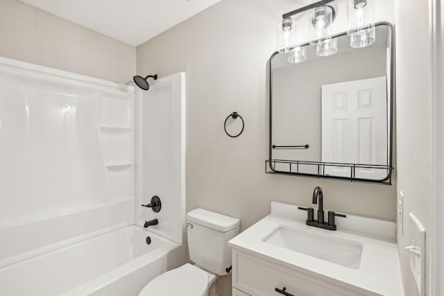 bathroom with a textured ceiling, shower / tub combination, vanity, and toilet