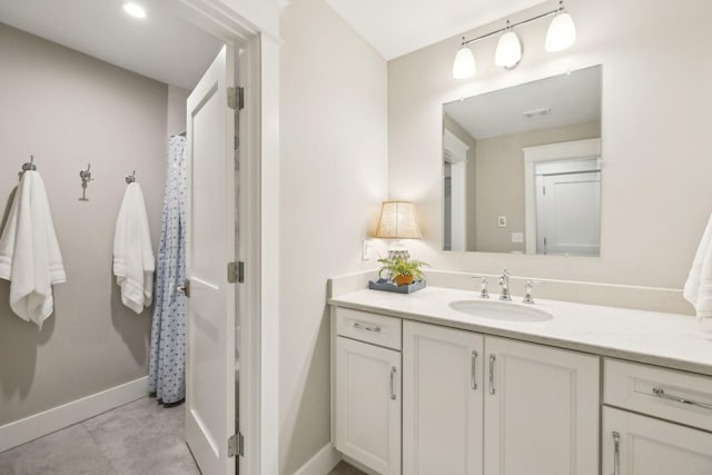 bathroom with baseboards and vanity