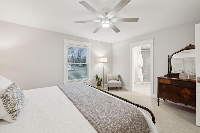 bedroom with carpet floors, ensuite bathroom, baseboards, and a ceiling fan