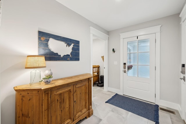 entryway with visible vents and baseboards