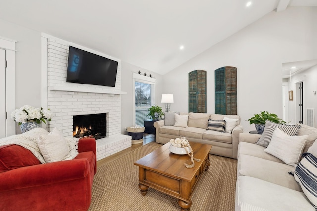 living room featuring high vaulted ceiling, recessed lighting, a brick fireplace, and beamed ceiling