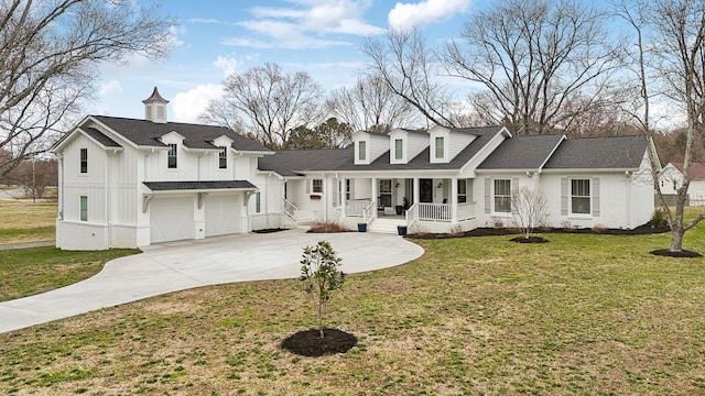 view of front facade with a porch, a garage, concrete driveway, board and batten siding, and a front yard